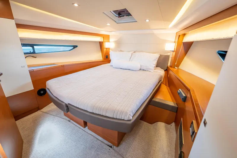 Whiskey And Waves Yacht Photos Pics Luxurious cabin interior of a 2017 Prestige 500 yacht with a comfortable bed.