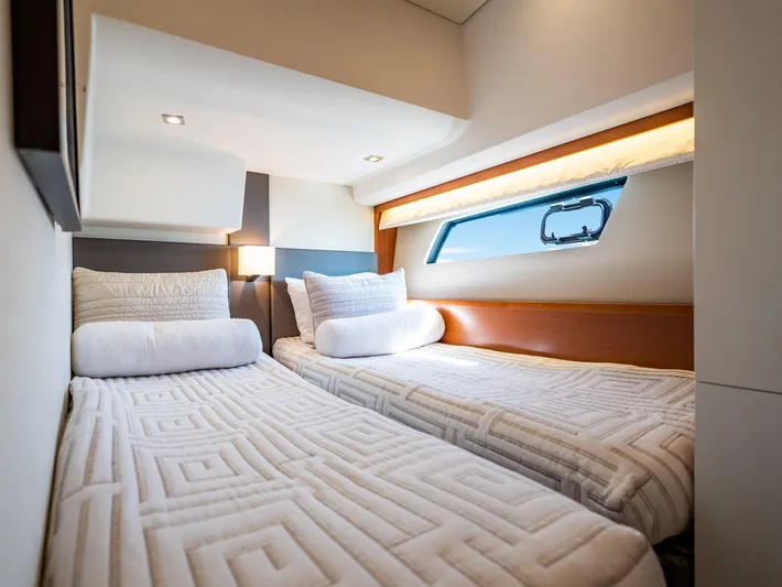 Whiskey And Waves Yacht Photos Pics Luxurious twin cabin interior of 2017 Prestige 500 yacht with modern bedding and window view.