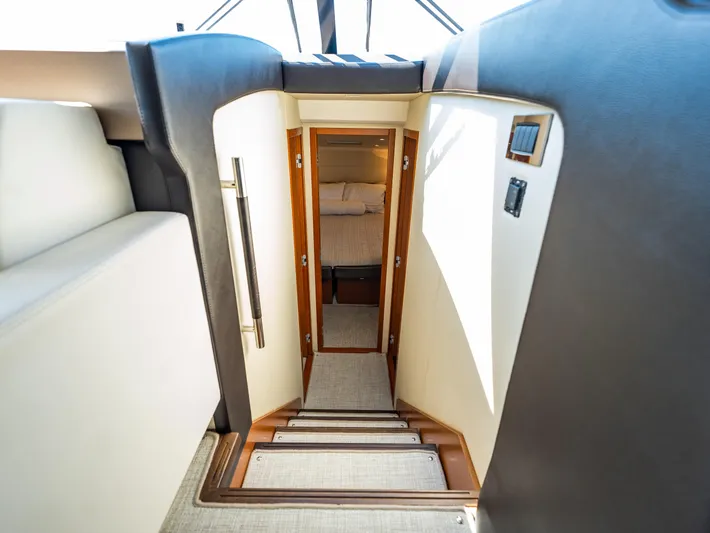 Whiskey And Waves Yacht Photos Pics Stairway leading to cabin interior of 2017 Prestige 500 yacht.