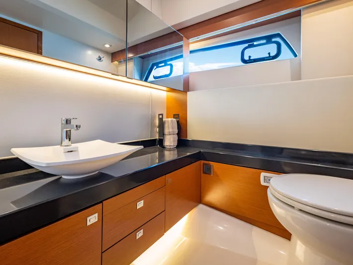 Whiskey And Waves Yacht Photos Pics Luxurious bathroom interior on a 2017 Prestige 500 yacht, featuring modern fixtures and elegant design.