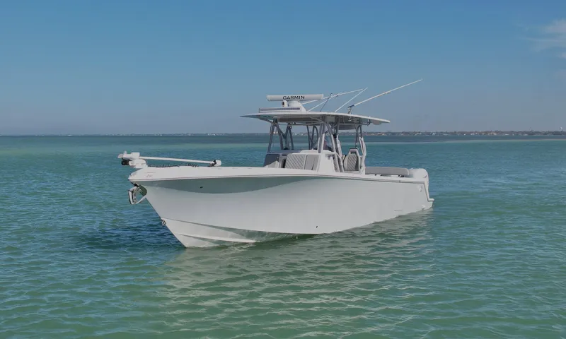  Yacht Photos Pics 2020 SeaVee 370z boat on calm turquoise waters under clear blue sky.