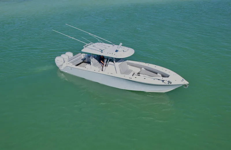  Yacht Photos Pics 2020 SeaVee 370z boat on calm turquoise water, featuring a sleek design and multiple outboard engines.