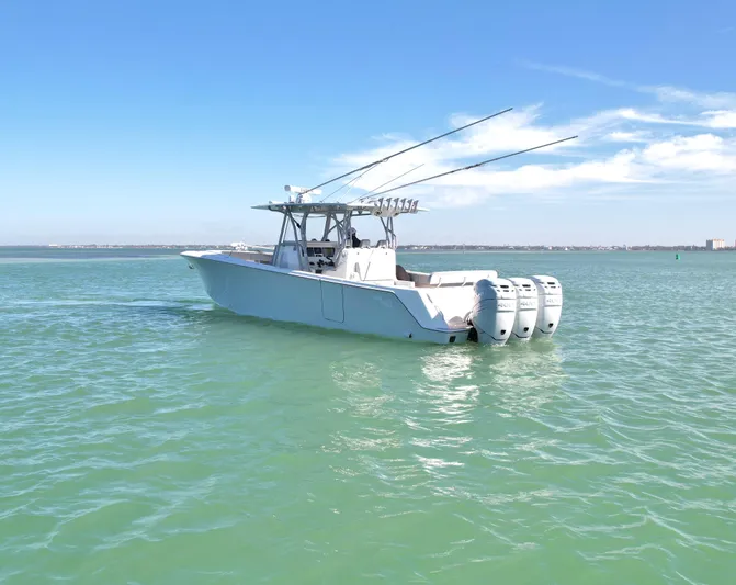  Yacht Photos Pics 2020 SeaVee 370z boat with triple outboard engines on calm water.