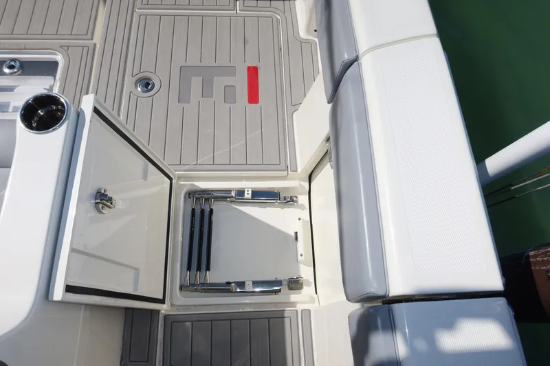  Yacht Photos Pics 2020 SeaVee 370z boat deck with storage compartment and seating.