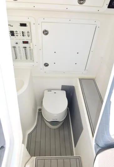  Yacht Photos Pics 2020 SeaVee 370z boat interior with compact marine toilet and control panel.
