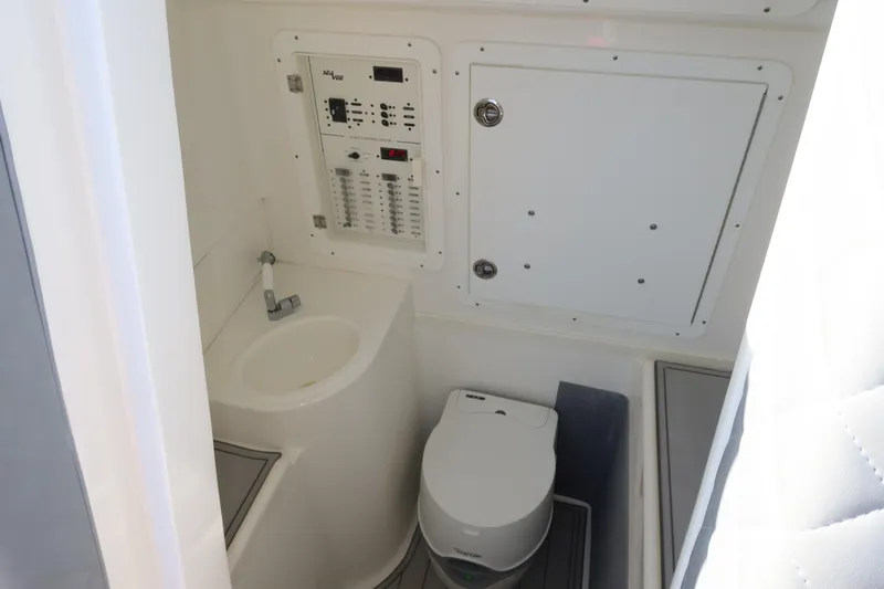  Yacht Photos Pics Compact bathroom in 2020 SeaVee 370z boat with sink and toilet.