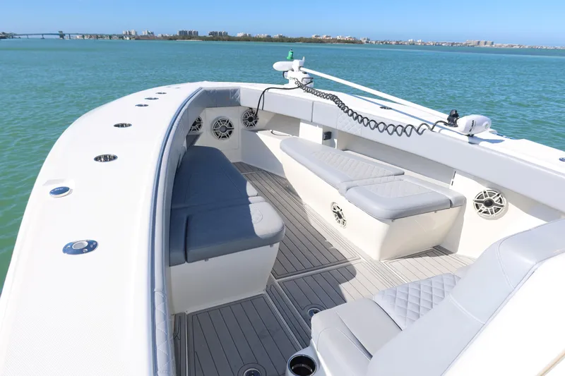  Yacht Photos Pics 2020 SeaVee 370z boat interior with cushioned seating on calm water.