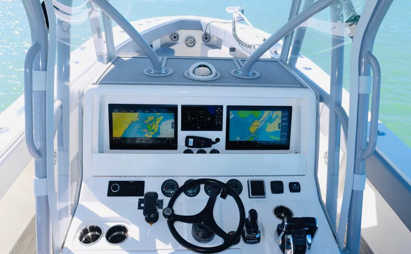  Yacht Photos Pics 2020 SeaVee 370z boat cockpit with dual navigation screens and steering wheel.