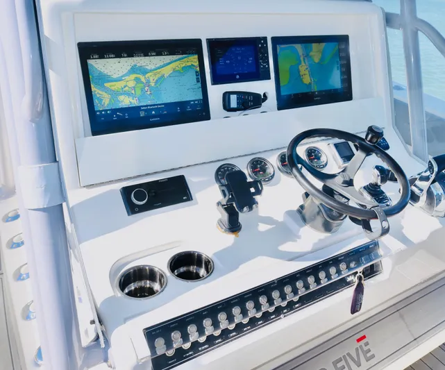  Yacht Photos Pics 2020 SeaVee 370z boat dashboard with navigation screens and steering wheel.