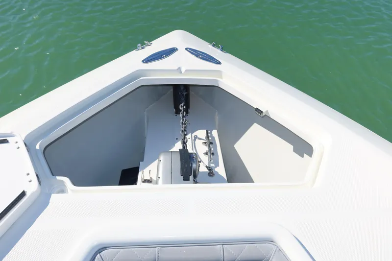  Yacht Photos Pics Bow of 2020 SeaVee 370z boat with anchor storage, on calm green water.