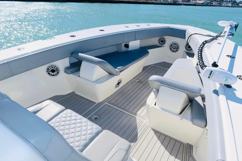  Yacht Photos Pics 2020 SeaVee 370z boat interior with cushioned seating and modern design on calm water.