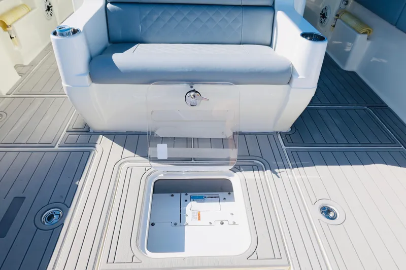 Yacht Photos Pics 2020 SeaVee 370z boat interior with cushioned seating and open storage compartment.