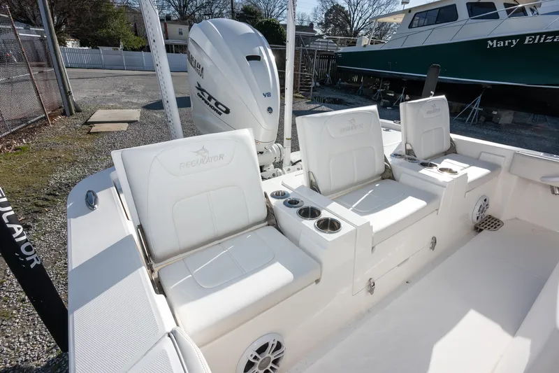Our Trade Yacht Photos Pics 2024 Regulator 26XO boat interior with seating and Yamaha XTO V8 engine.