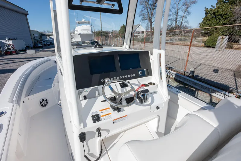 Our Trade Yacht Photos Pics 2024 Regulator 26XO boat cockpit with modern controls and dual displays.