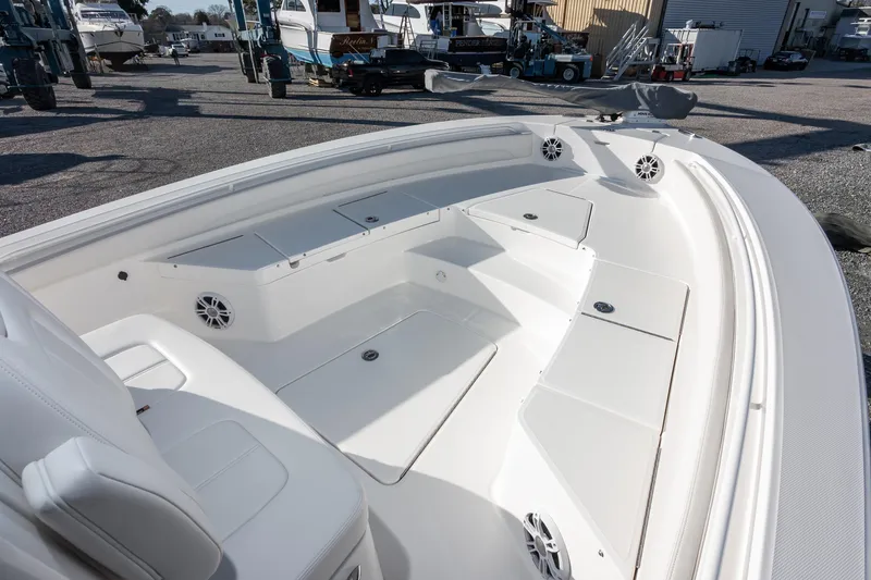 Our Trade Yacht Photos Pics 2024 Regulator 26XO boat interior with seating and storage compartments.