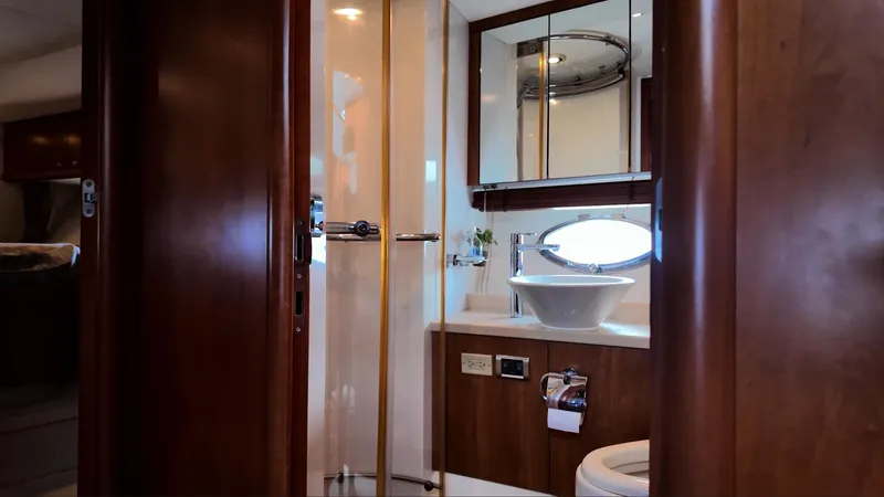 Itaca Yacht Photos Pics Luxurious bathroom interior of 2008 Sunseeker Manhattan 60 yacht with modern fixtures.