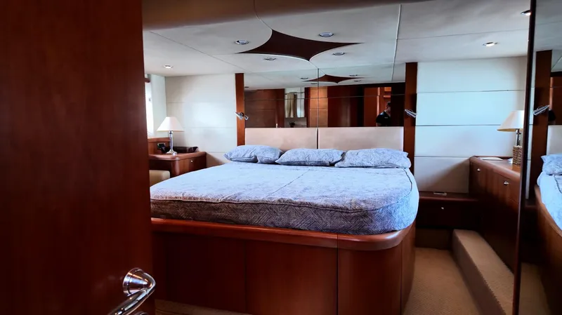 Itaca Yacht Photos Pics Luxurious bedroom interior of 2008 Sunseeker Manhattan 60 yacht with elegant wood finishes.