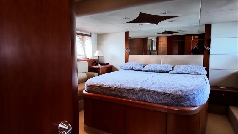 Itaca Yacht Photos Pics Luxurious bedroom interior of 2008 Sunseeker Manhattan 60 yacht with elegant wood finishes.