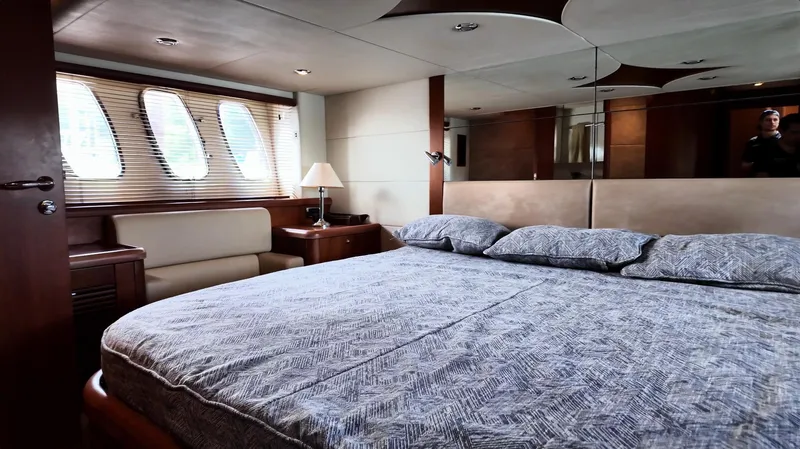 Itaca Yacht Photos Pics Luxurious bedroom interior of 2008 Sunseeker Manhattan 60 yacht with elegant furnishings.