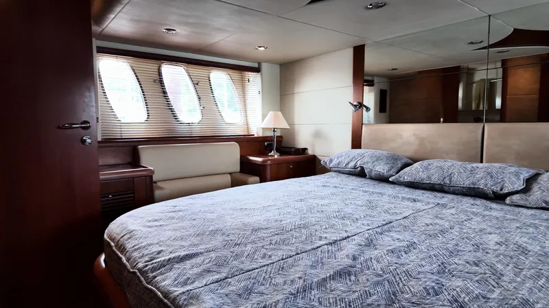 Itaca Yacht Photos Pics Luxurious bedroom interior of 2008 Sunseeker Manhattan 60 yacht with elegant furnishings.