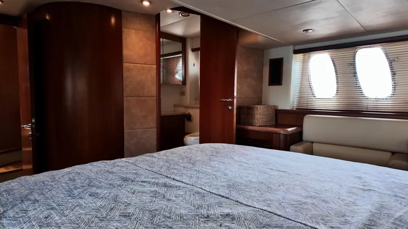 Itaca Yacht Photos Pics Luxurious cabin interior of 2008 Sunseeker Manhattan 60 yacht with elegant wood finishes.