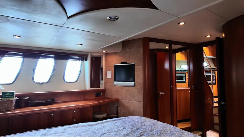 Itaca Yacht Photos Pics Luxurious interior of 2008 Sunseeker Manhattan 60 yacht with wood finishes and modern amenities.