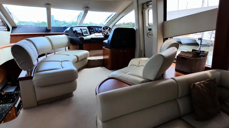 Itaca Yacht Photos Pics Luxurious interior of 2008 Sunseeker Manhattan 60 yacht with plush seating and helm.