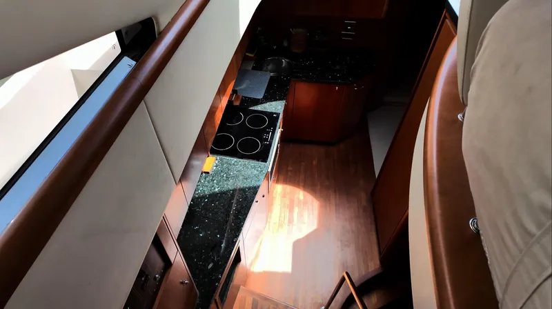 Itaca Yacht Photos Pics Luxurious kitchen interior of 2008 Sunseeker Manhattan 60 yacht, featuring modern appliances.