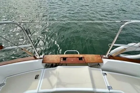 Blue Aweigh Yacht Photos Pics 2021 Tartan 345 sailboat deck overlooking calm water.