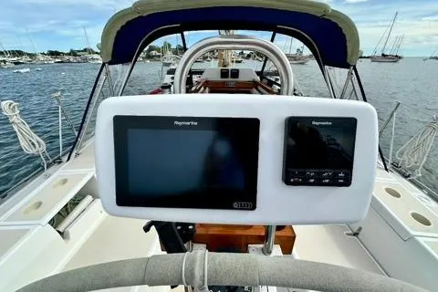 Blue Aweigh Yacht Photos Pics Tartan 345 sailboat cockpit with navigation system, 2021 model, docked in marina.