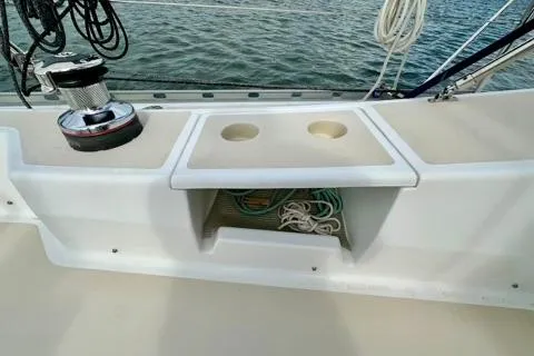 Blue Aweigh Yacht Photos Pics 2021 Tartan 345 sailboat deck with winch, cup holders, and rope storage.