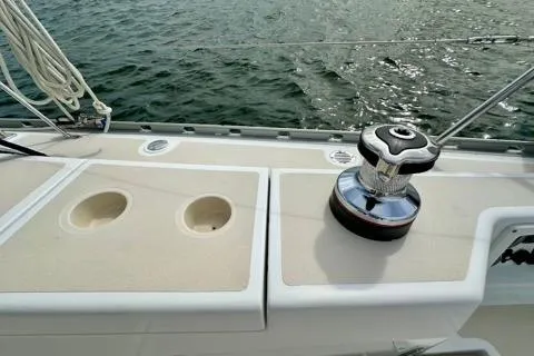 Blue Aweigh Yacht Photos Pics 2021 Tartan 345 sailboat deck with winch and rope, on calm water.