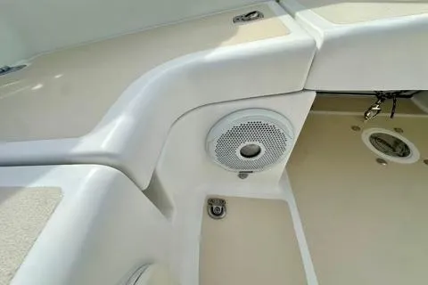 Blue Aweigh Yacht Photos Pics 2021 Tartan 345 boat interior with speaker and storage compartment.