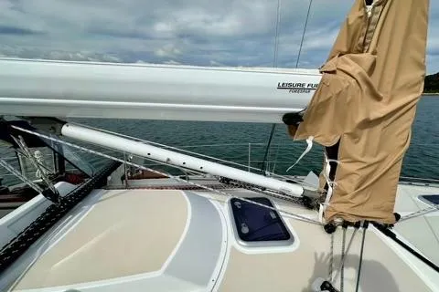 Blue Aweigh Yacht Photos Pics Sailboat deck view of 2021 Tartan 345 with covered mast and clear sky.
