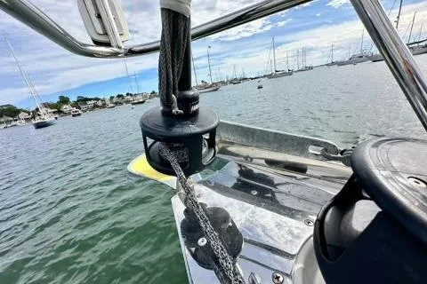 Blue Aweigh Yacht Photos Pics 2021 Tartan 345 sailboat anchored in a marina with scenic harbor view.