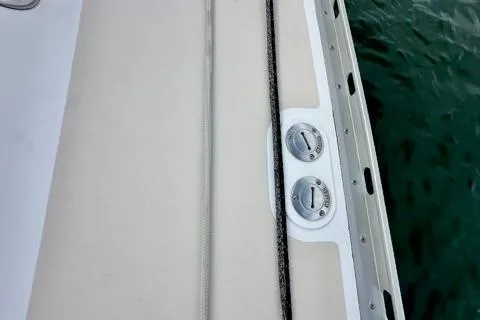 Blue Aweigh Yacht Photos Pics 2021 Tartan 345 boat deck with cleats and ropes by the water.