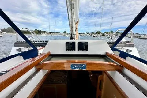 Blue Aweigh Yacht Photos Pics Cockpit view of 2021 Tartan 345 sailboat with marina background.