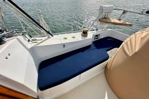 Blue Aweigh Yacht Photos Pics 2021 Tartan 345 sailboat cockpit with blue seating and water view.