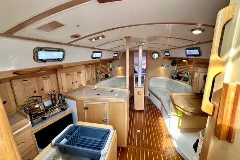 Blue Aweigh Yacht Photos Pics Interior of 2021 Tartan 345 sailboat with wooden cabinetry and modern amenities.