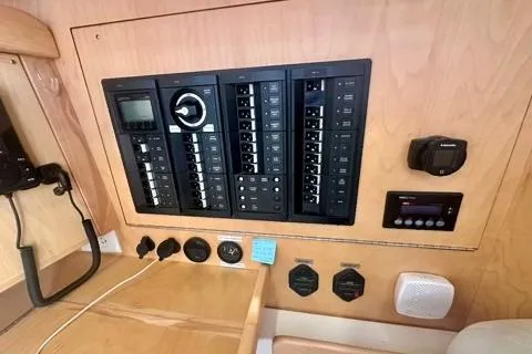 Blue Aweigh Yacht Photos Pics Control panel of a 2021 Tartan 345 yacht with various switches and gauges.