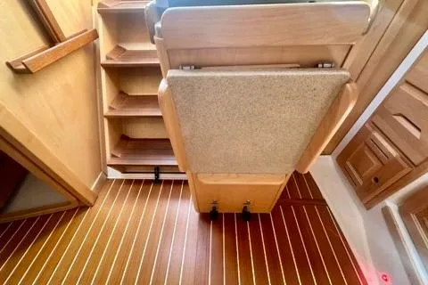 Blue Aweigh Yacht Photos Pics Interior of 2021 Tartan 345 yacht with wooden flooring and seating.