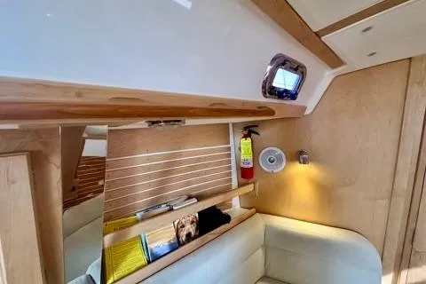 Blue Aweigh Yacht Photos Pics Interior of 2021 Tartan 345 sailboat with cozy seating and wooden accents.
