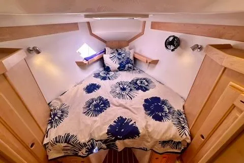 Blue Aweigh Yacht Photos Pics Cozy cabin interior of 2021 Tartan 345 yacht with floral bedding.