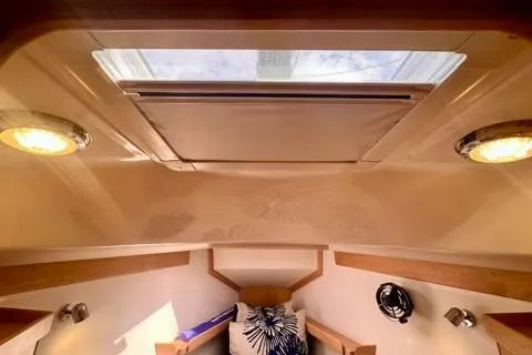 Blue Aweigh Yacht Photos Pics Interior cabin of 2021 Tartan 345 sailboat with skylight and cozy seating.