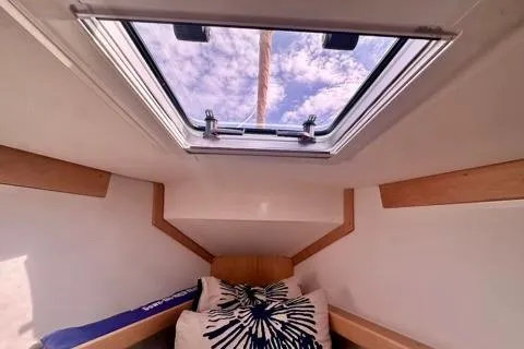 Blue Aweigh Yacht Photos Pics Interior cabin view of 2021 Tartan 345 sailboat with skylight and cushions.