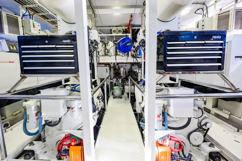 Kapal Yacht Photos Pics Engine room of a 1971 Feadship yacht, featuring toolboxes and mechanical equipment.