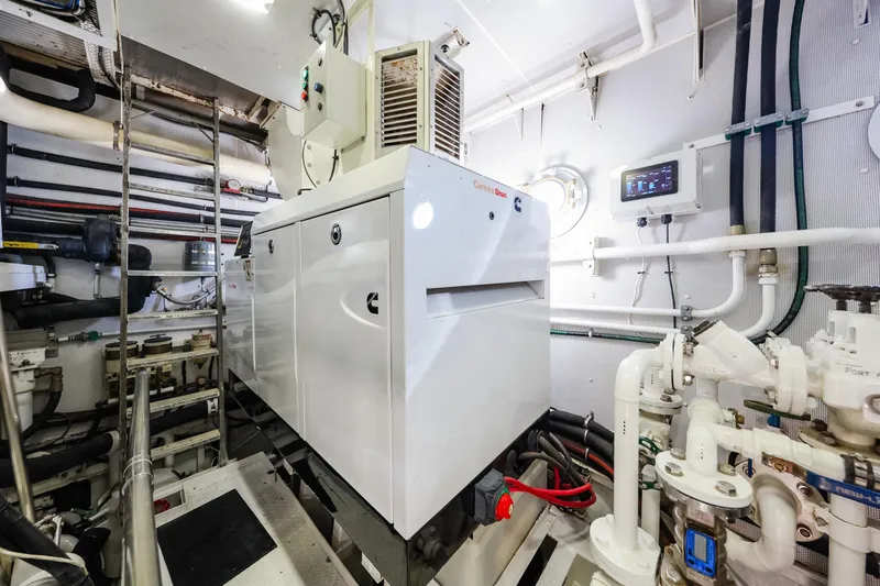 Kapal Yacht Photos Pics Engine room of a 1971 Feadship yacht featuring Cummins Onan generator.