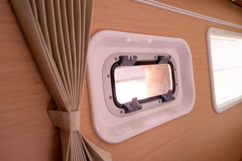 Dream Seeker Yacht Photos Pics Interior view of Lagoon 380 S2 yacht window with beige curtains, 2011 model.