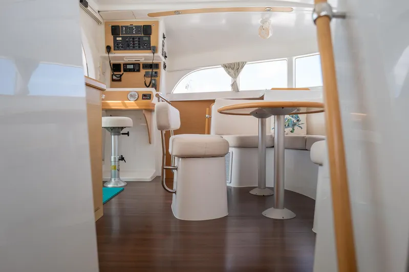 Dream Seeker Yacht Photos Pics Interior of 2011 Lagoon 380 S2 catamaran with seating area and navigation controls.