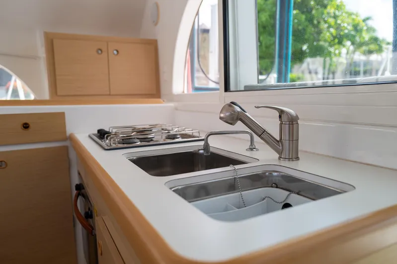 Dream Seeker Yacht Photos Pics Modern kitchen in 2011 Lagoon 380 S2 yacht with sink and stove.